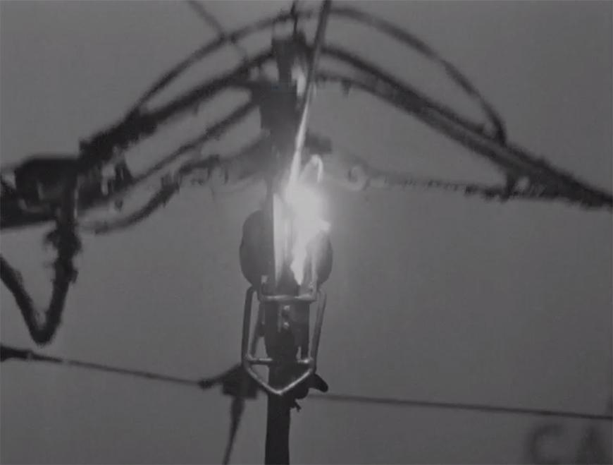 light emerging from an electrical fixture with wires behind it