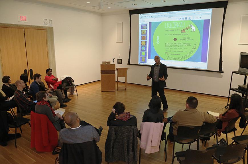 classroom with students watching a presentation on a screen