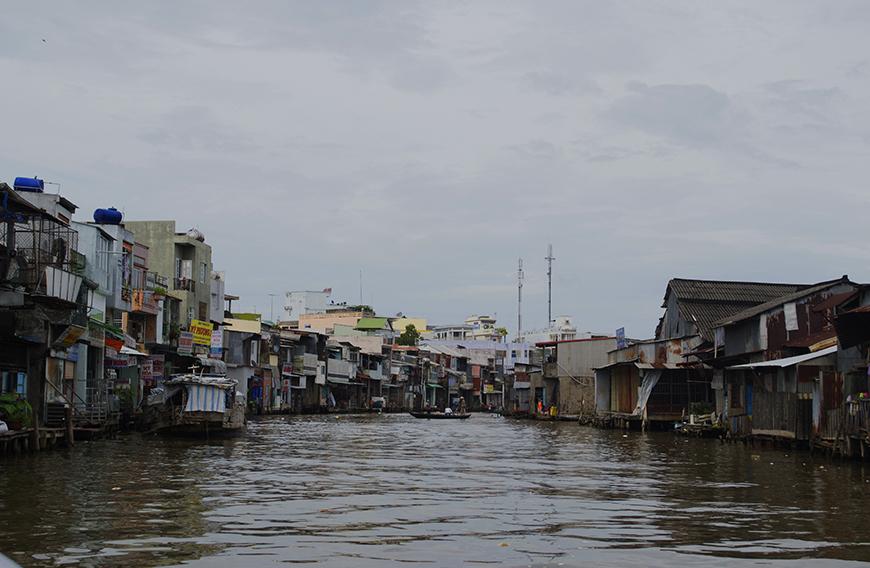 informal housing settlement built on a river in Vietnam