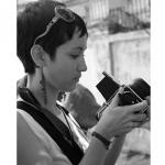 Headshot of a Woman Looking into a Camera