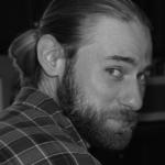 Headshot of a Man with Long Hair