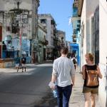 a student and faculty member on a street in Havana, Cuba